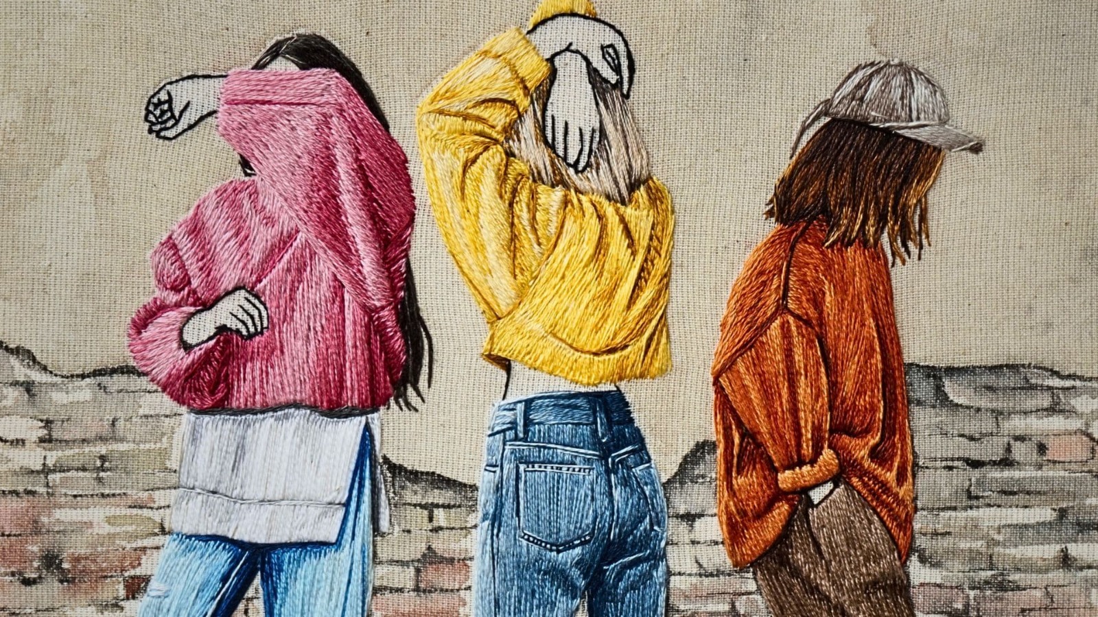 Embroidery artwork of three women